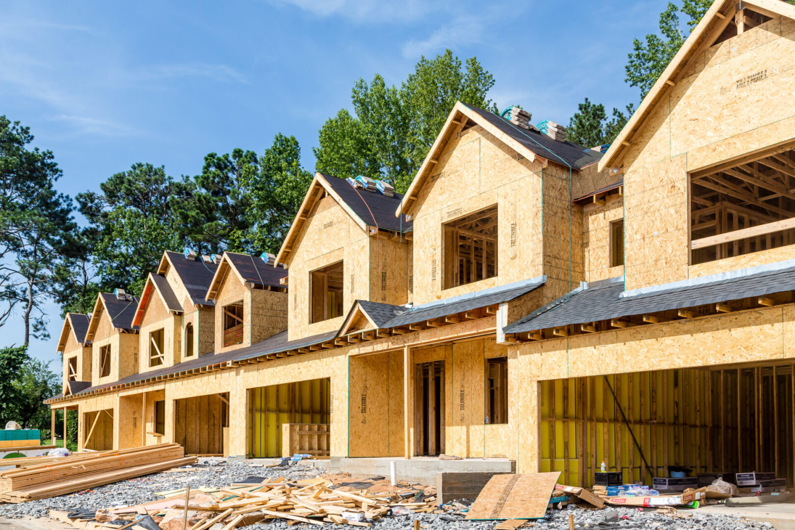 New Row House Construction with wood sheathing and asphalt roof